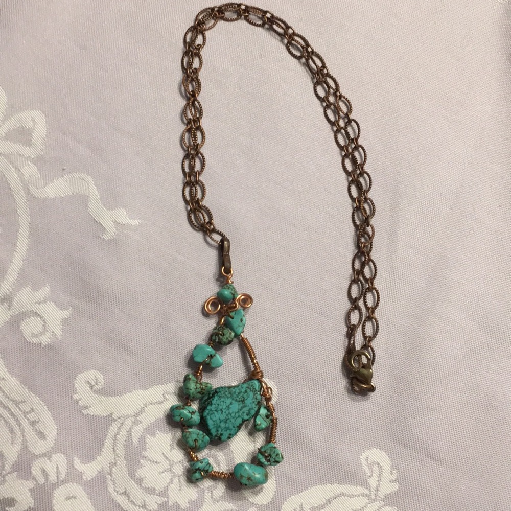 Copper necklace with turquoise beads.